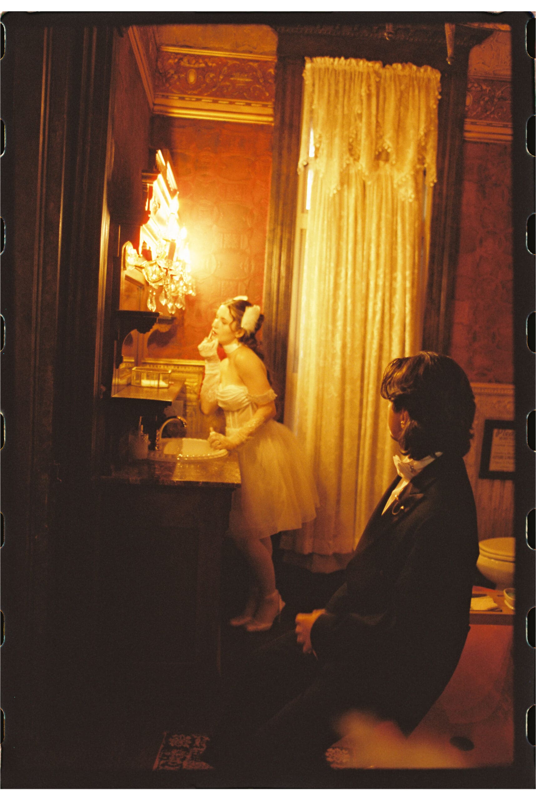 Vintage wedding couple in victorian bathroom taken on film